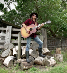 John playing the guitar